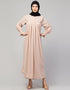 Chic Abaya with pleated chest and bell sleeves for a casual look In Color Blush Skin