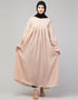 Chic Abaya with pleated chest and bell sleeves for a casual look In Color Blush Skin