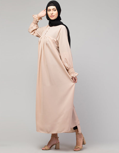 Chic Abaya with pleated chest and bell sleeves for a casual look In Color Blush Skin