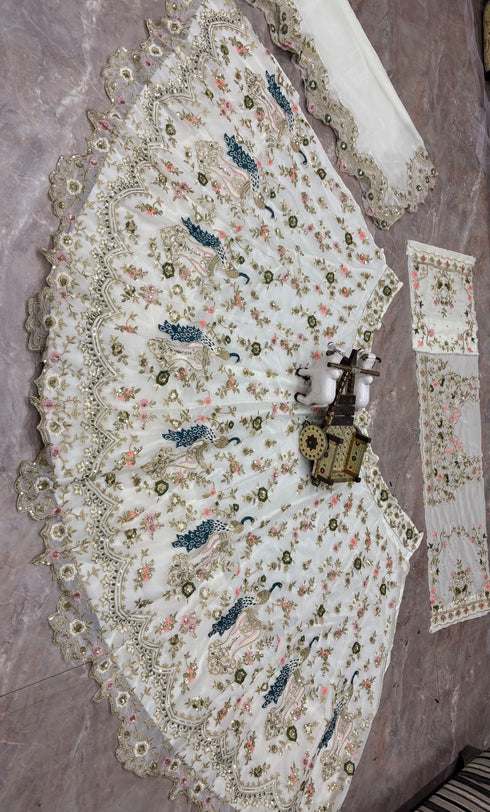 Off White Faux Georgette Lehenga Choli Ethnic Sequins Embroidery Cut Work Lehenga With Cancan & Canvas Patta - Detail View | Samyak Fashion